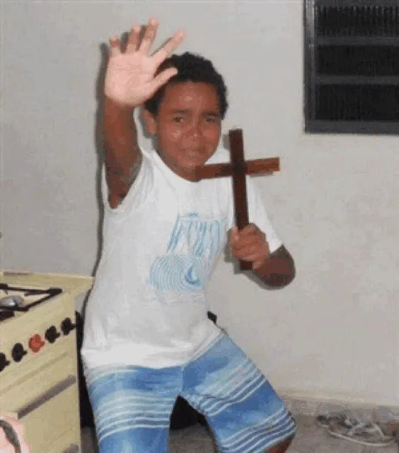 Scared Kid Holding Cross meme template