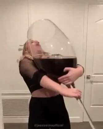 Woman Hiding Behind Giant Wine Glass GIF template